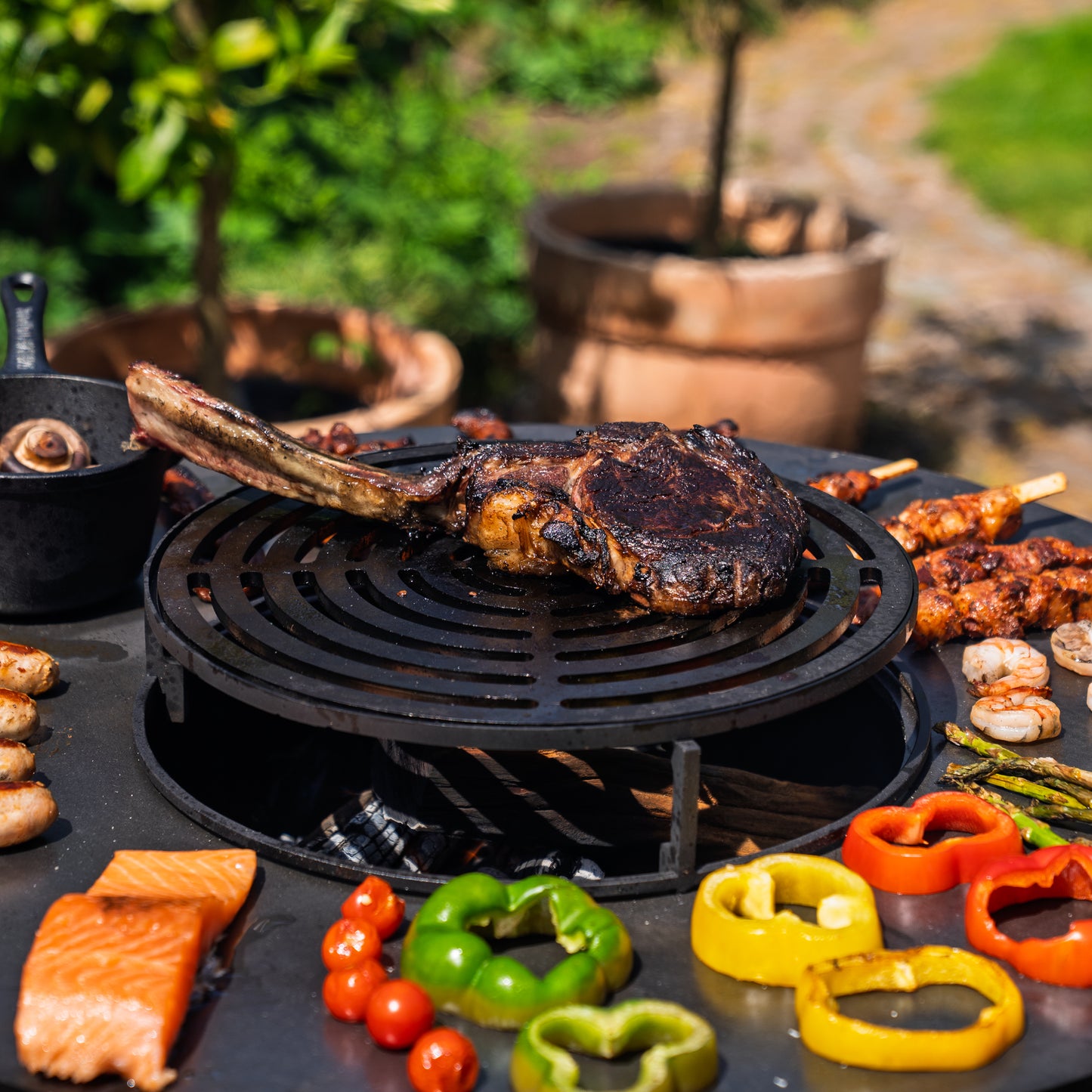 BBQ Plancha Grill Hermano XXL Blackline - With poker and wood storage Ø80cm 8mm